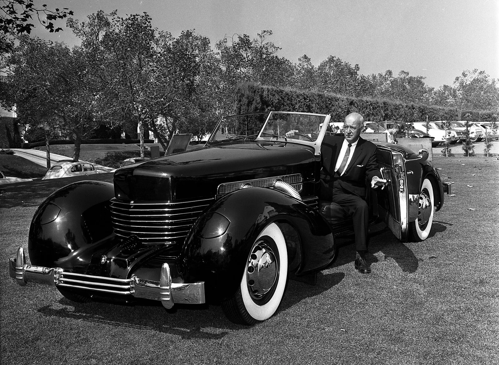Gordon Buehrig fondly looks over a Cord Sportsman, one of the original Cord automobiles. He designed the interior and exterior of the famous