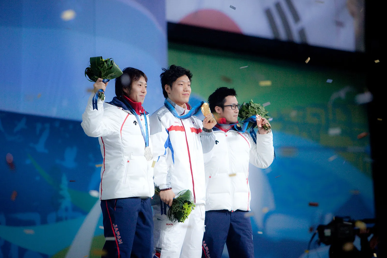 Keiichiro Nagashima (JAP, gold), Mo Tae-bum (KOR, gold) and Joji Kato (JAP, bronze), winners of the Men's 500 metres speed skating