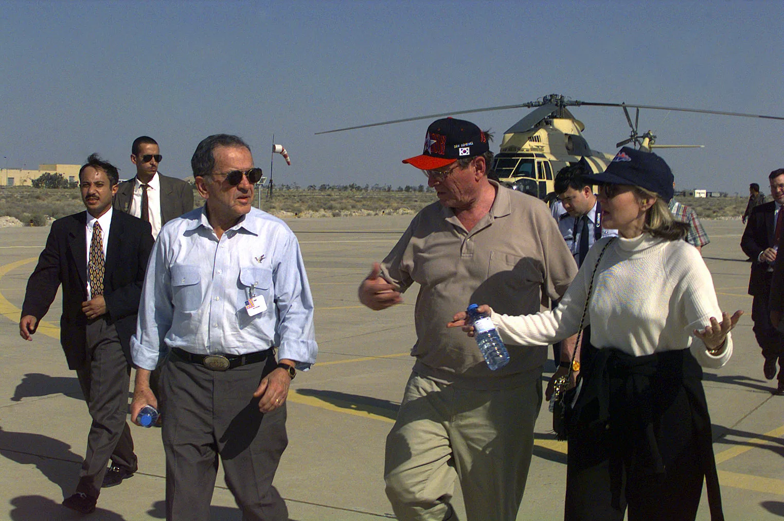 Senators Ted Stevens of Arkansas (left), Pete Domenici of New Mexico and Kay Bailey Hutchinson of Texas, arrive at Ahmed Al Jaber Air Base, 