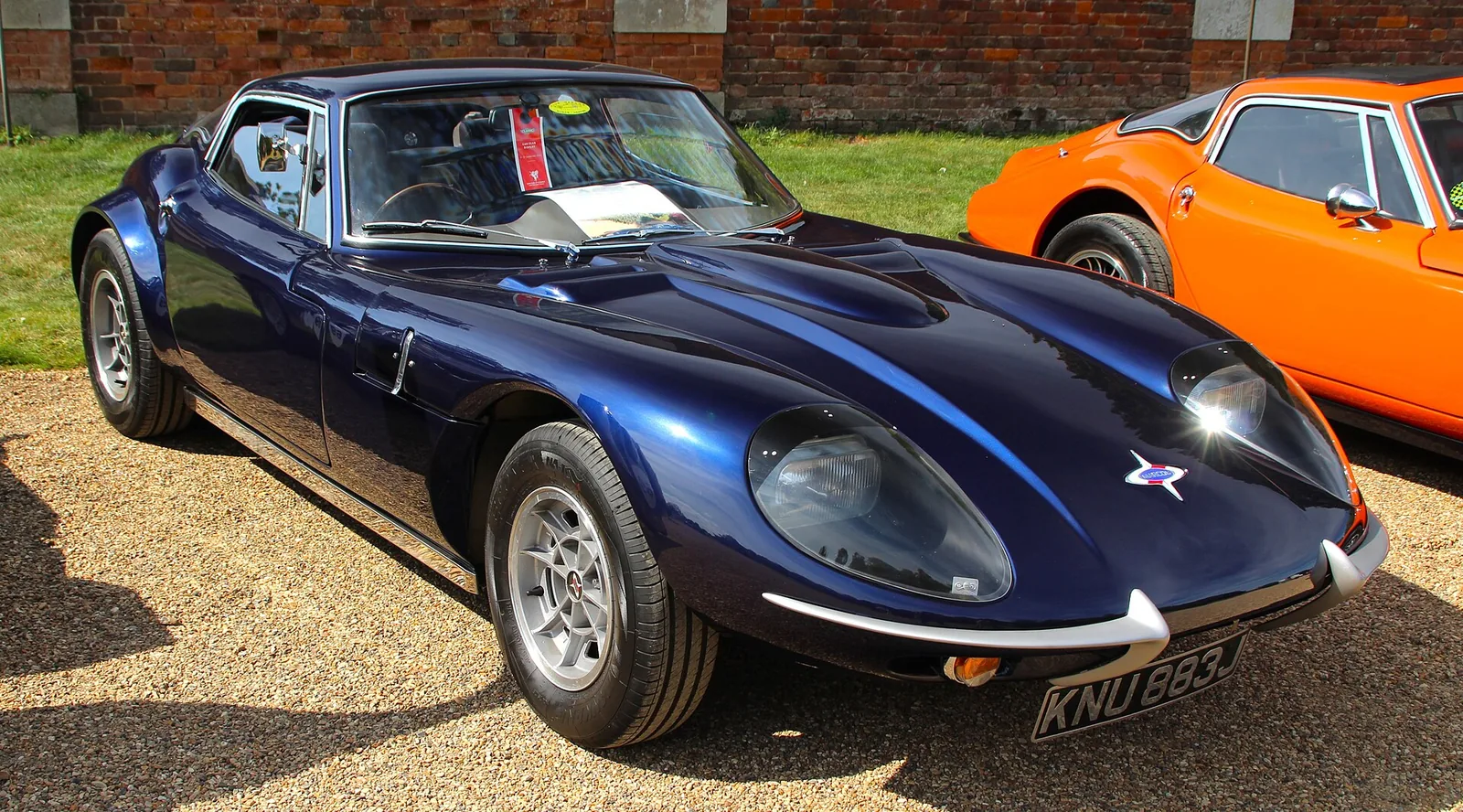 A 1970 Marcos GT taken at Hampton Court Concours 2023.