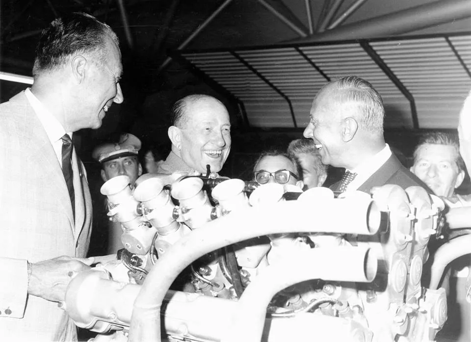 Adolfo Orsi (center) and Maserati people, possily Bindo Maserati (in front right, smiling; actually also looks like racecar driver Franco Co