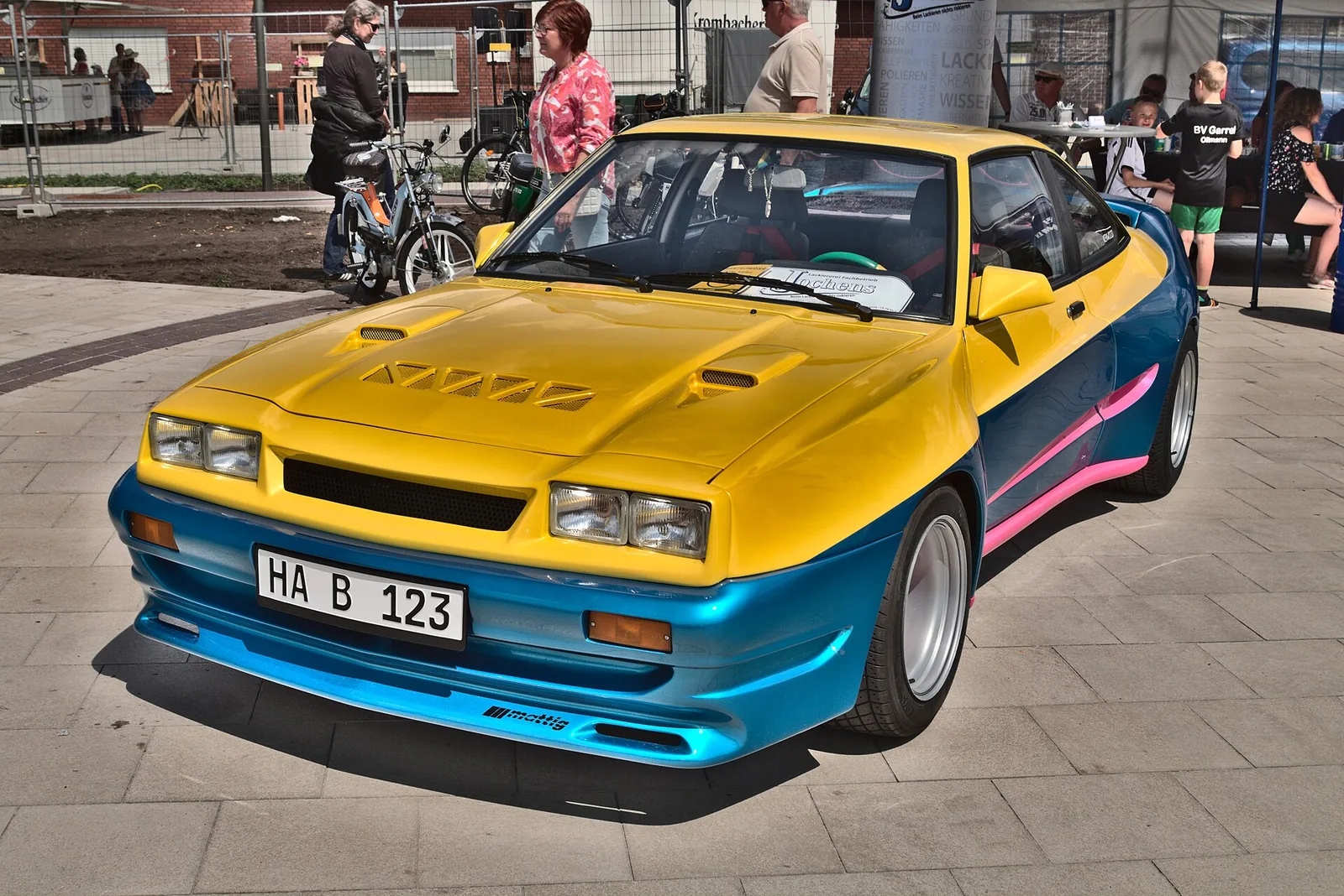 An Opel Manta B GSi with Mattig tuning (replica of the car driven by Til Schweiger) on the "Garreler Classics" classic car show, seen from t