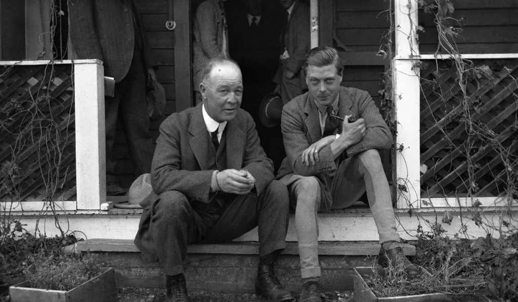 Edward, the Prince of Wales and en:George Harry Webster sitting on the steps of the EP Ranch, Pekisko, Alberta.